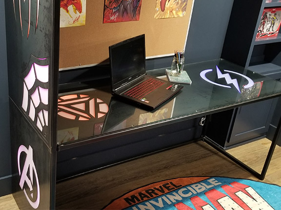 Blackened steel Marvel logos desk