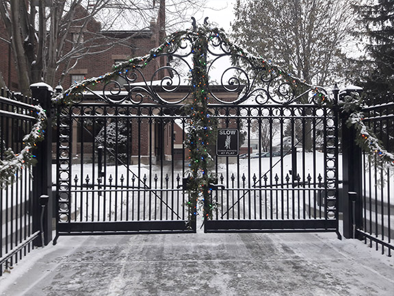 Ornate driveway gate with decorations