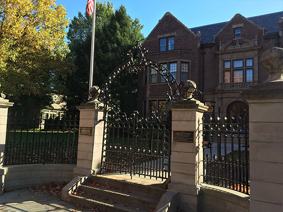 Ornate gate in front of house